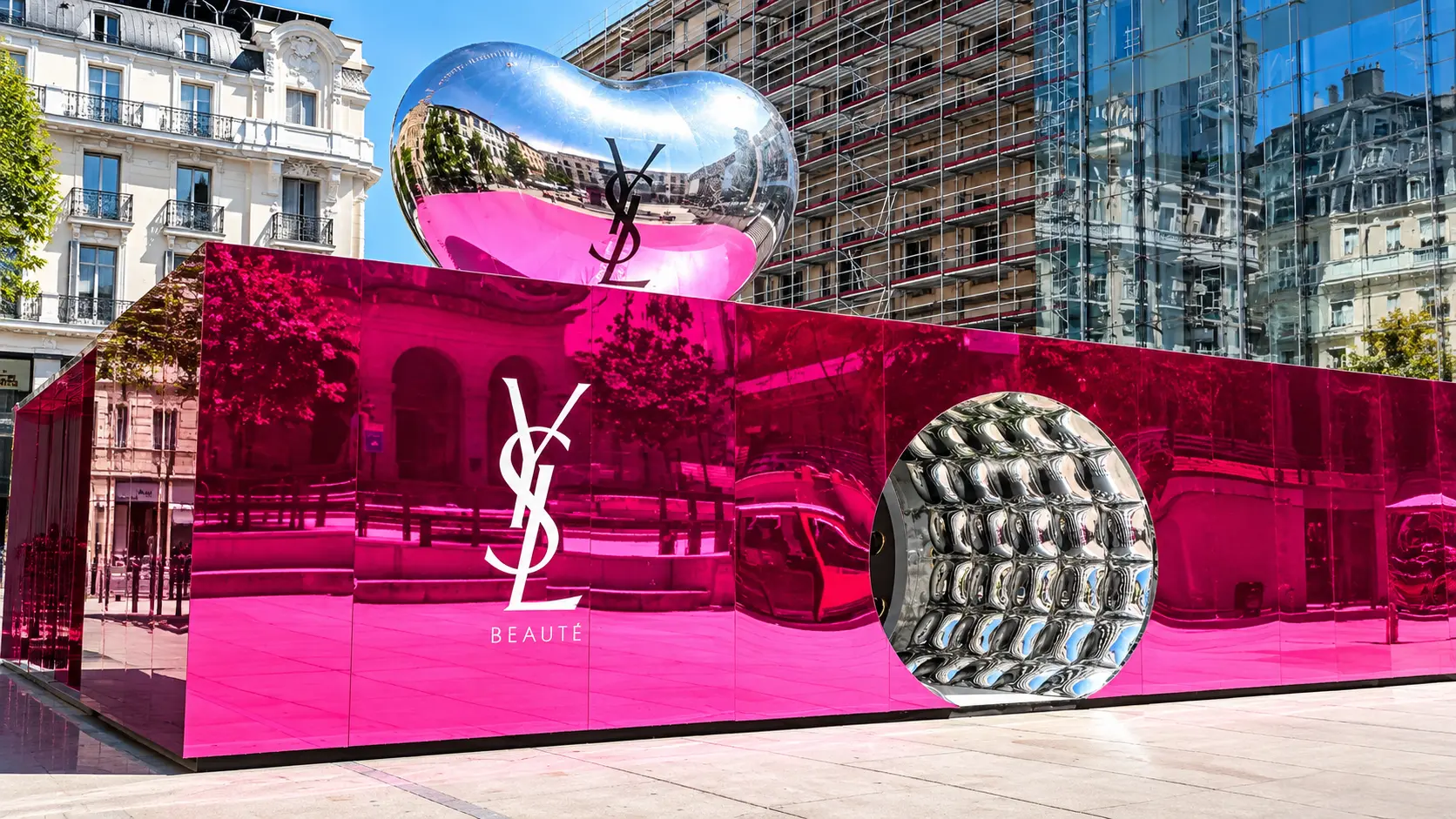 Pink mirrored pavilion in a Paris square with a silver heart and the YSL Beauté logo